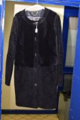 A LADIES TORY BURCH DARK NAVY LAMBSKIN THIGH LENGTH COAT, with pockets and five gilt detail buttons,