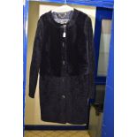 A LADIES TORY BURCH DARK NAVY LAMBSKIN THIGH LENGTH COAT, with pockets and five gilt detail buttons,