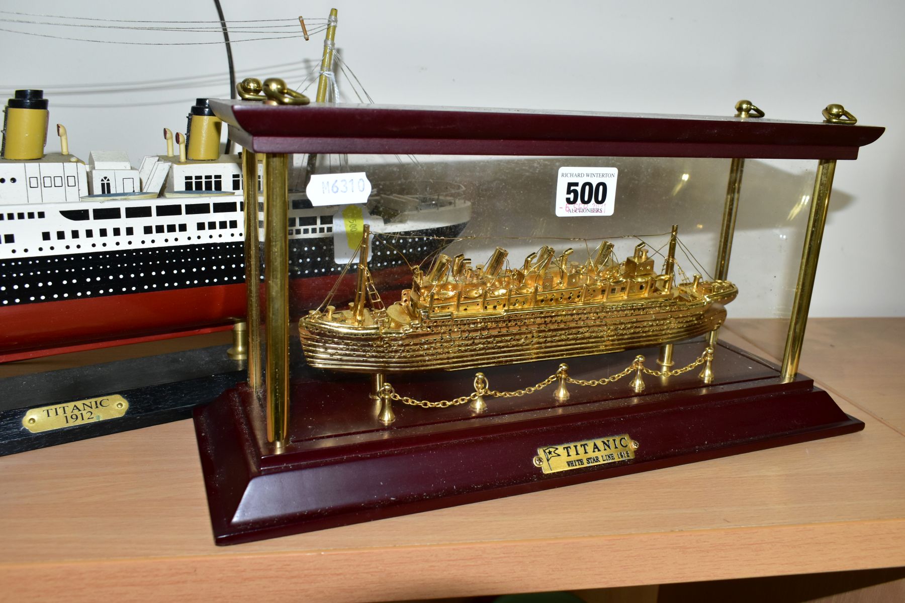 TWO MODERN MODELS OF THE TITANIC, once in glass case, 35.5cm x 17cm x 12.5cm including case, ship is
