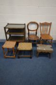 A CARVED OAK STOOL, with a later base and glass panel, along with an oak tea trolley, two chairs and