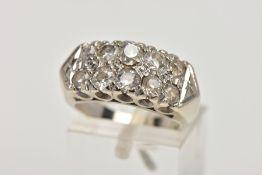 A WHITE METAL DIAMOND RING, designed with two rows of claw set, graduated old and round brilliant