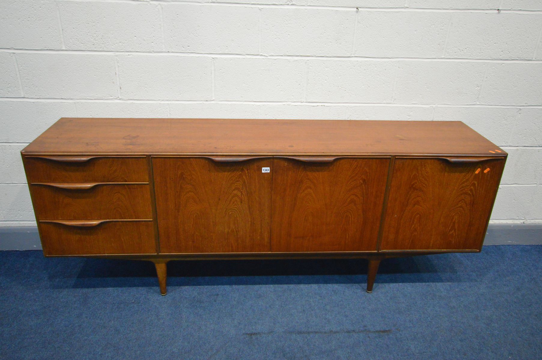 A MCINTOSH AND CO TEAK SIDEBOARD, with three drawers, the top drawer with cutlery dividers and baize