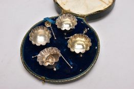 A CASED SET OF FOUR SILVER SALTS WITH SALT SPOONS, each salt of a round shape, scallop rims,