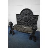 A LARGE CAST IRON FIRE BACK, GRATE AND ANDIRONS, in the 17th century style, the fire back