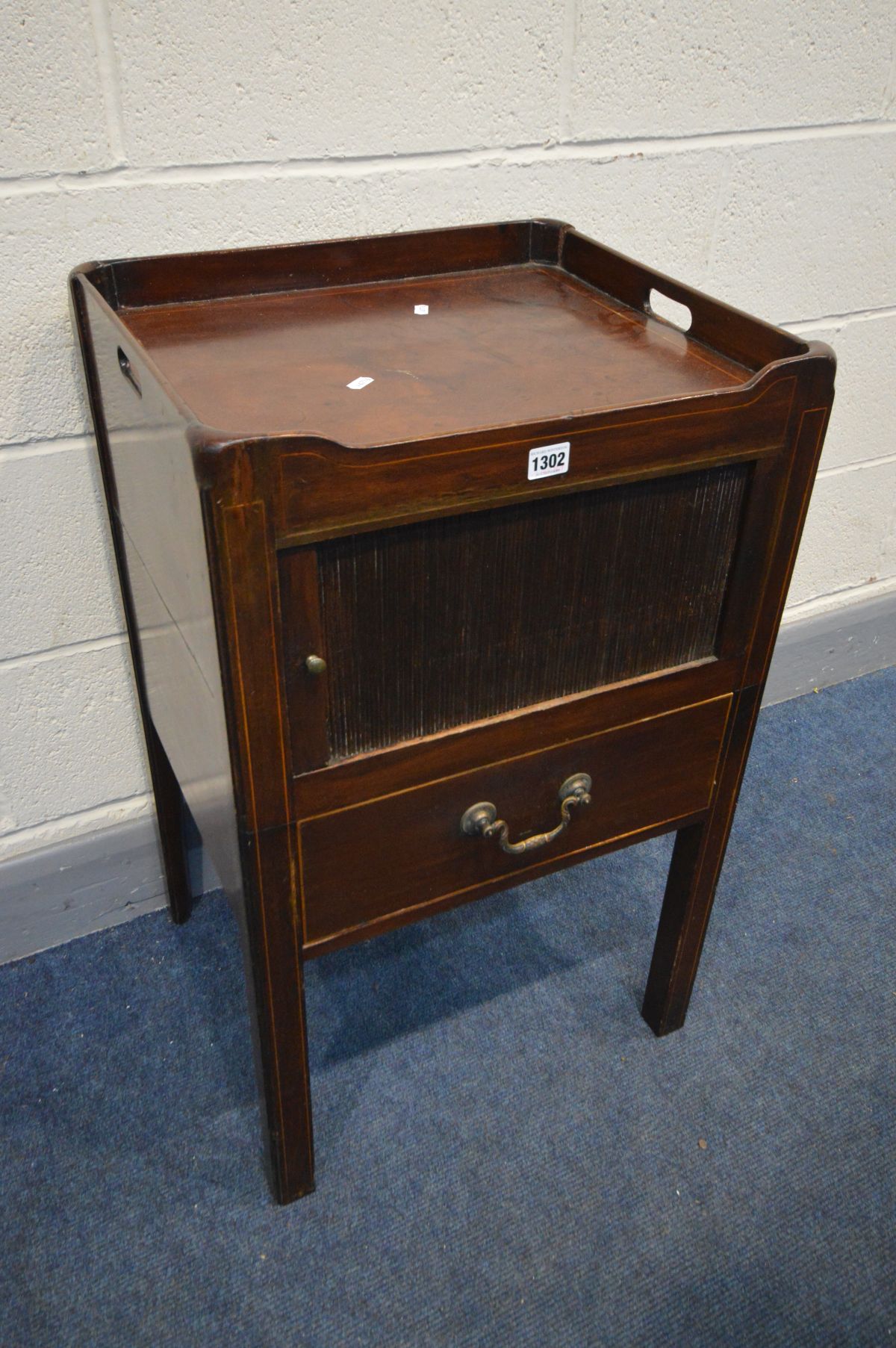 A GEORGIAN MAHOGANY AND BOX STRUNG INLAID TRAY TOP COMMODE, with a horizontal tambour front door,