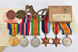 A FAMILY RELATED GROUP OF MEDALS as follows, British War & Victory Medal pair named S4-217831 Pte