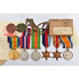 A FAMILY RELATED GROUP OF MEDALS as follows, British War & Victory Medal pair named S4-217831 Pte