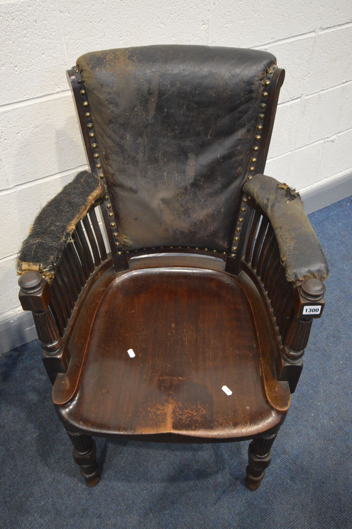 AN EARLY 20TH CENTURY MAHOGANY OFFICE ARMCHAIR, distressed leather, spindles armrests, dish seat, on - Image 2 of 7