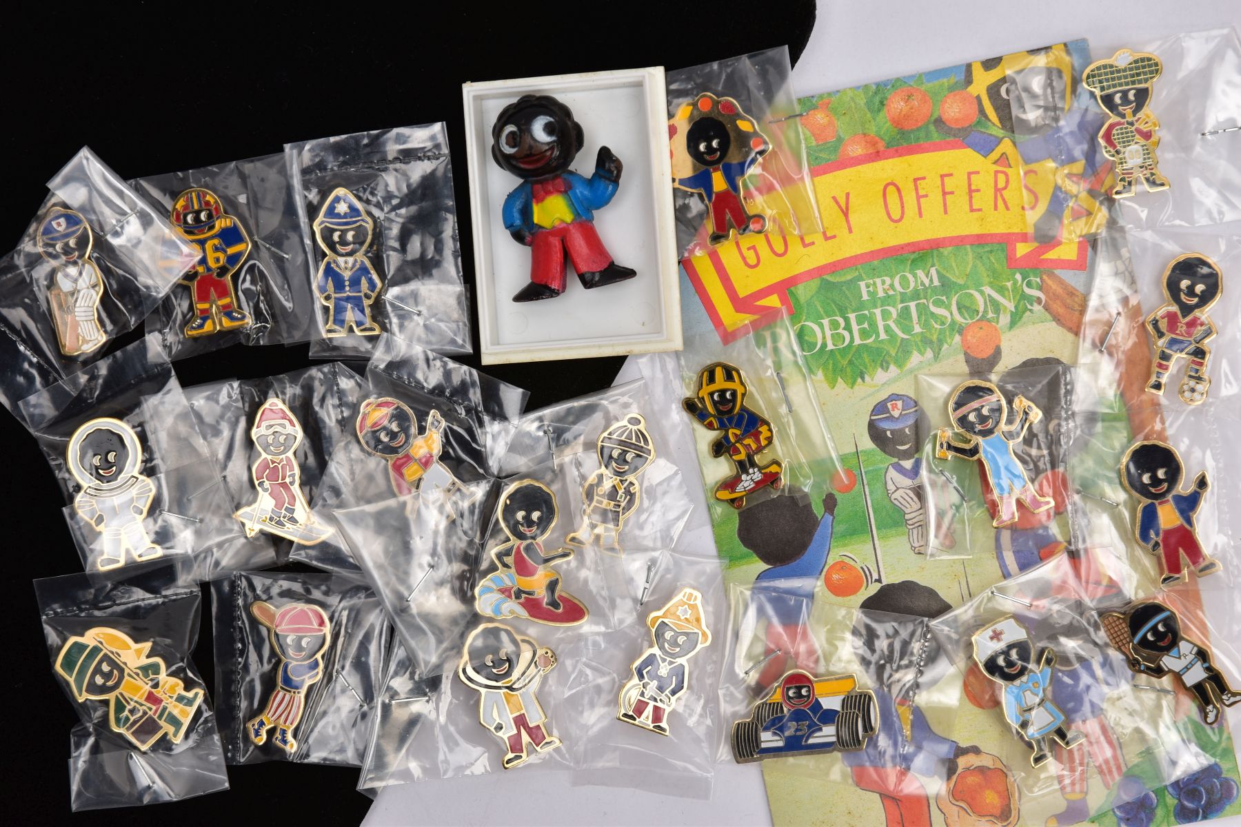 A FULL SET OF ROBERTSONS BROOCHES, AND A SMALL FIGURINE, to include a full set of twenty-one