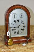 AN EARLY 20TH CENTURY MAHOGANY CASED DOME TOP MANTEL CLOCK, silver coloured arched dial with slow/