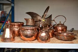 A GROUP OF NINE COPPER ITEMS, comprising a helmet shaped coal scuttle, height 32cm, punched