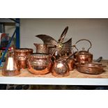 A GROUP OF NINE COPPER ITEMS, comprising a helmet shaped coal scuttle, height 32cm, punched