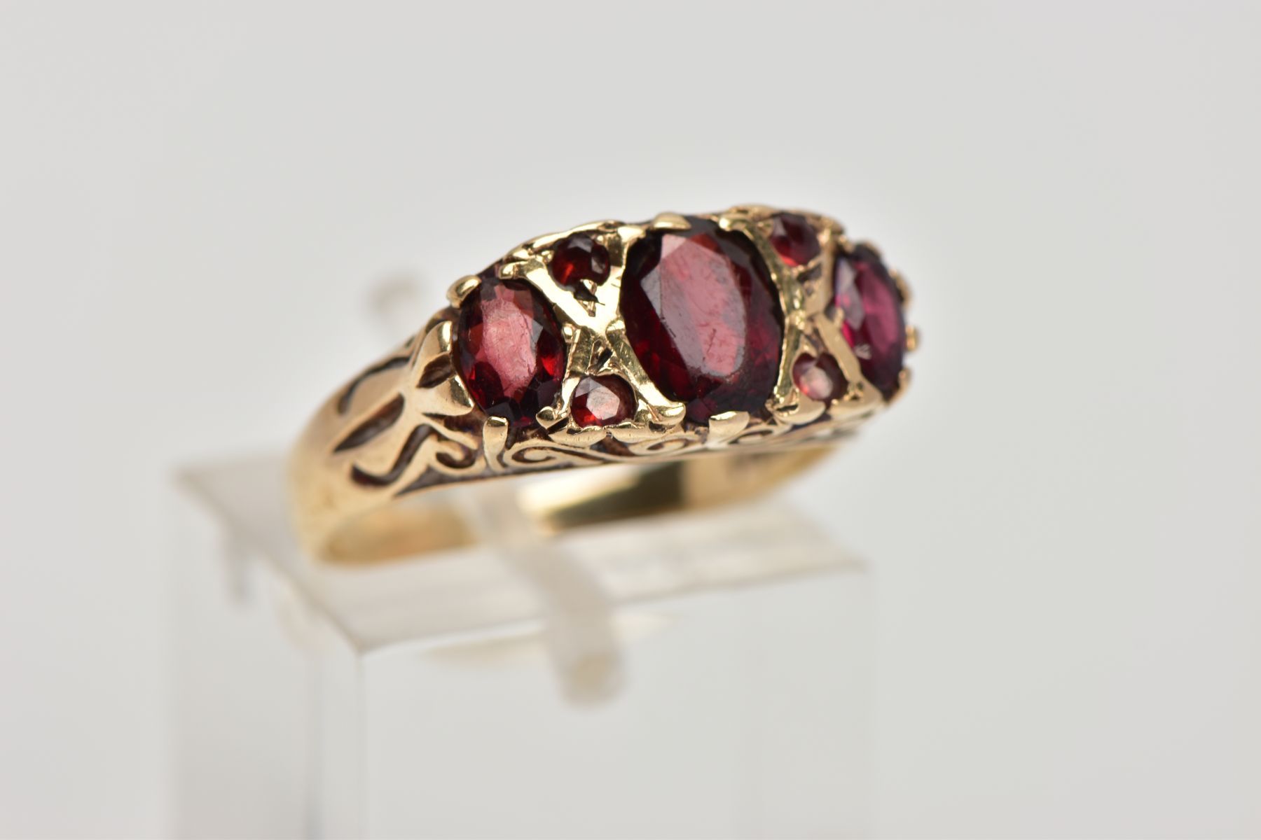 A 9CT GOLD THREE STONE GARNET RING, designed with a row of three graduated oval cut garnets, - Image 4 of 4