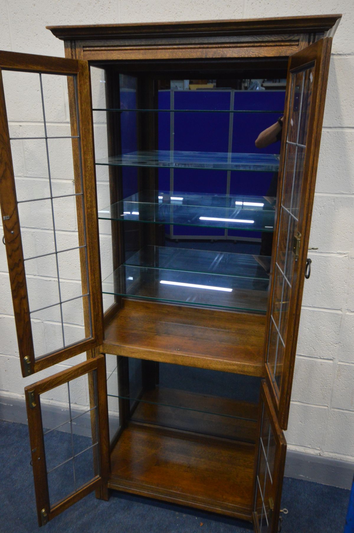 AN OAK LEAD GLAZED FOUR DOOR DISPLAY CABINET, enclosing five glass shelves and smoked mirror back, - Image 3 of 3