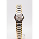 A LADIES BOXED 'RADO' WRISTWATCH, round silver dial signed 'RADO', spot markers, gold tone hands,