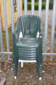 SIX GREEN PLASTIC STACKING GARDEN CHAIRS AND ANOTHER WHITE CHAIR (7)