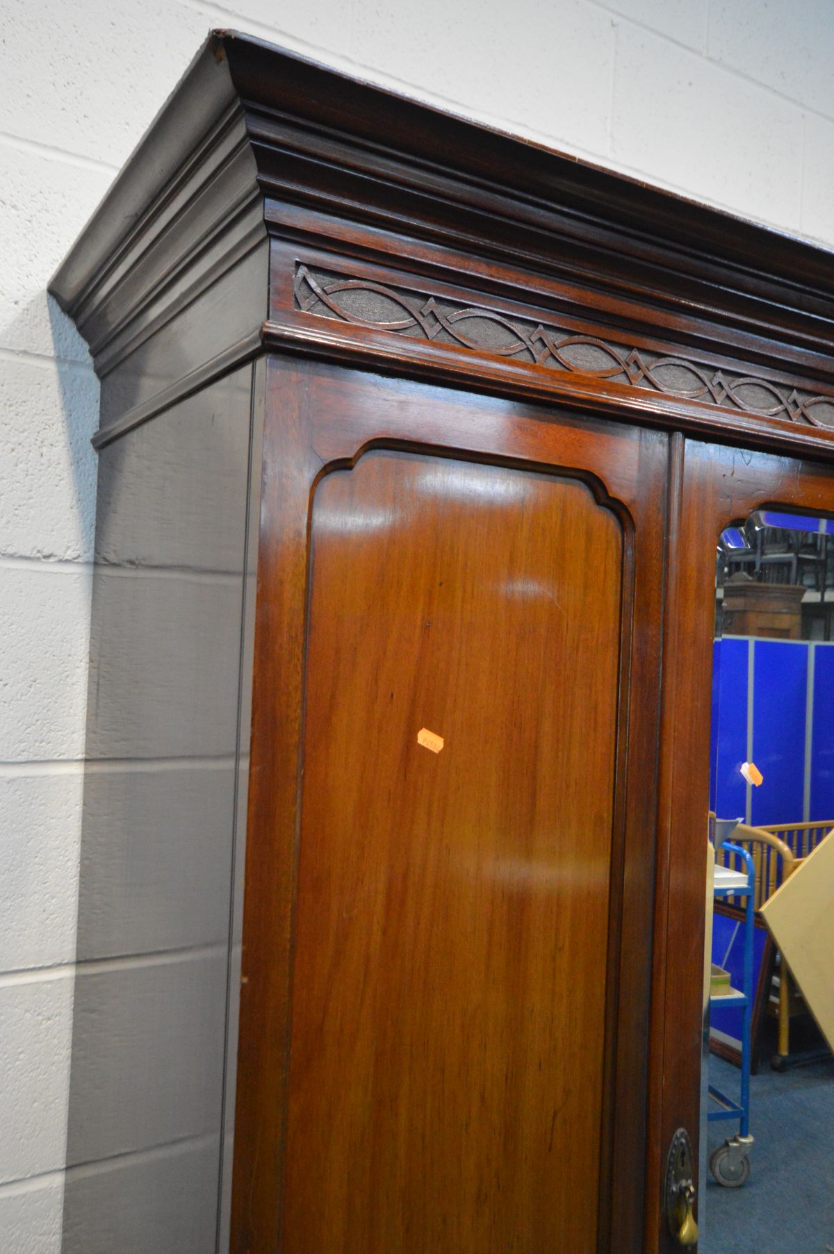 AN EDWARDIAN MAHOGANY MIRRORED SINGLE DOOR WARDROBE, the cornice with blind fretwork, above two - Image 2 of 2