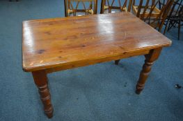 A STAINED PINE KITCHEN TABLE, length 122cm x depth 77cm x height 76cm