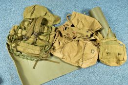 A BOX CONTAINING THREE MILITARY BAGS, one being a back pack with metal frame, and a length of padded