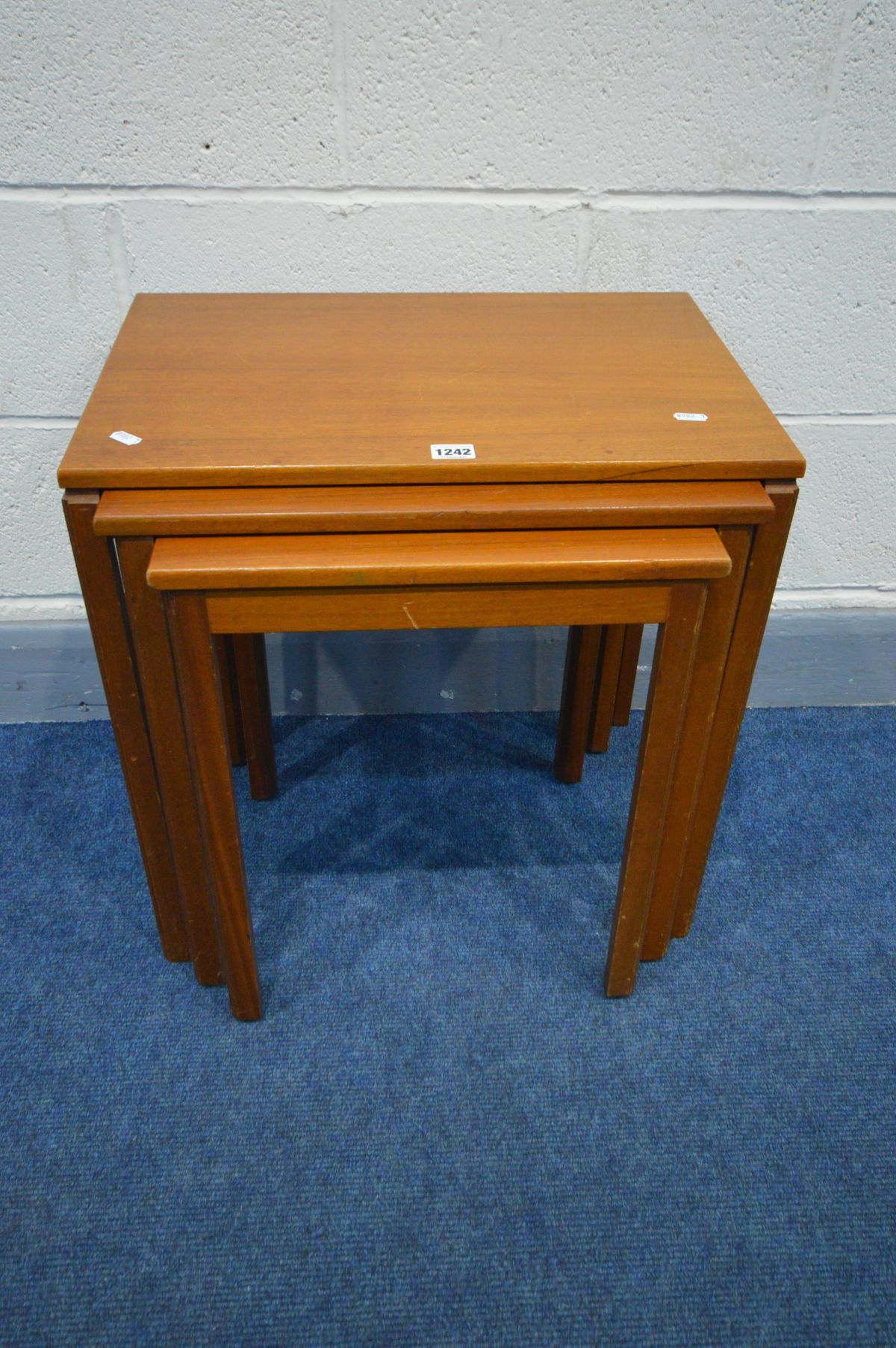 A MCINTOSH TEAK NEST OF THREE TABLES, largest table width 53cm x depth 36cm x height 54cm