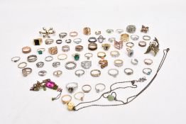 A BAG OF MOSTLY COSTUME RINGS, yellow and white metal rings in various styles, some fitted with