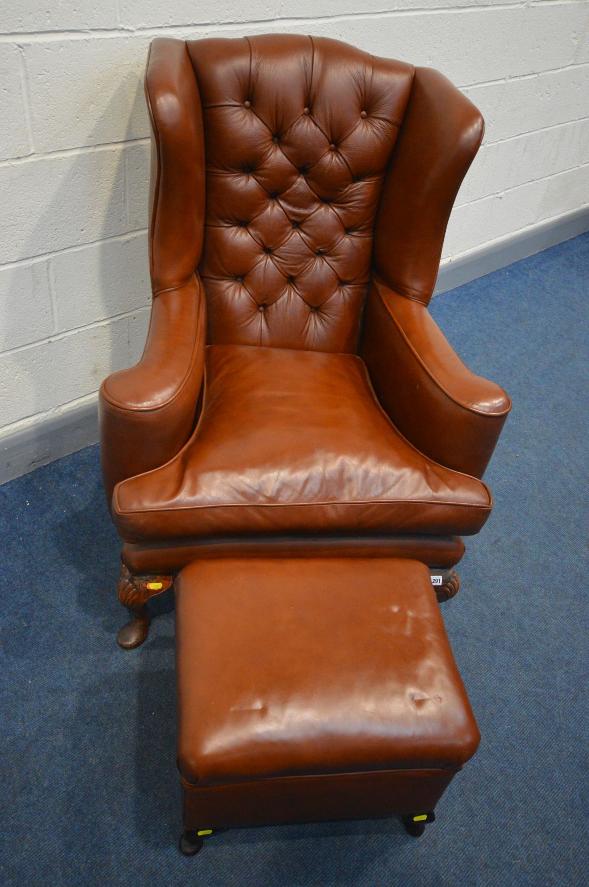 A BROWN LEATHER BUTTONED WING BACK ARMCHAIR, with flat outswept armrests, on cabriole front legs, - Image 2 of 3