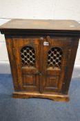 A HARDWOOD AND IRON TWO DOOR CABINET, width 53cm x depth 33cm x height 69cm