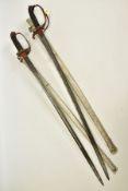 TWO x EXAMPLES OF 1945 PATTERN VICTORIAN INFANTRY SWORDS with metal scabbards, blade lengths