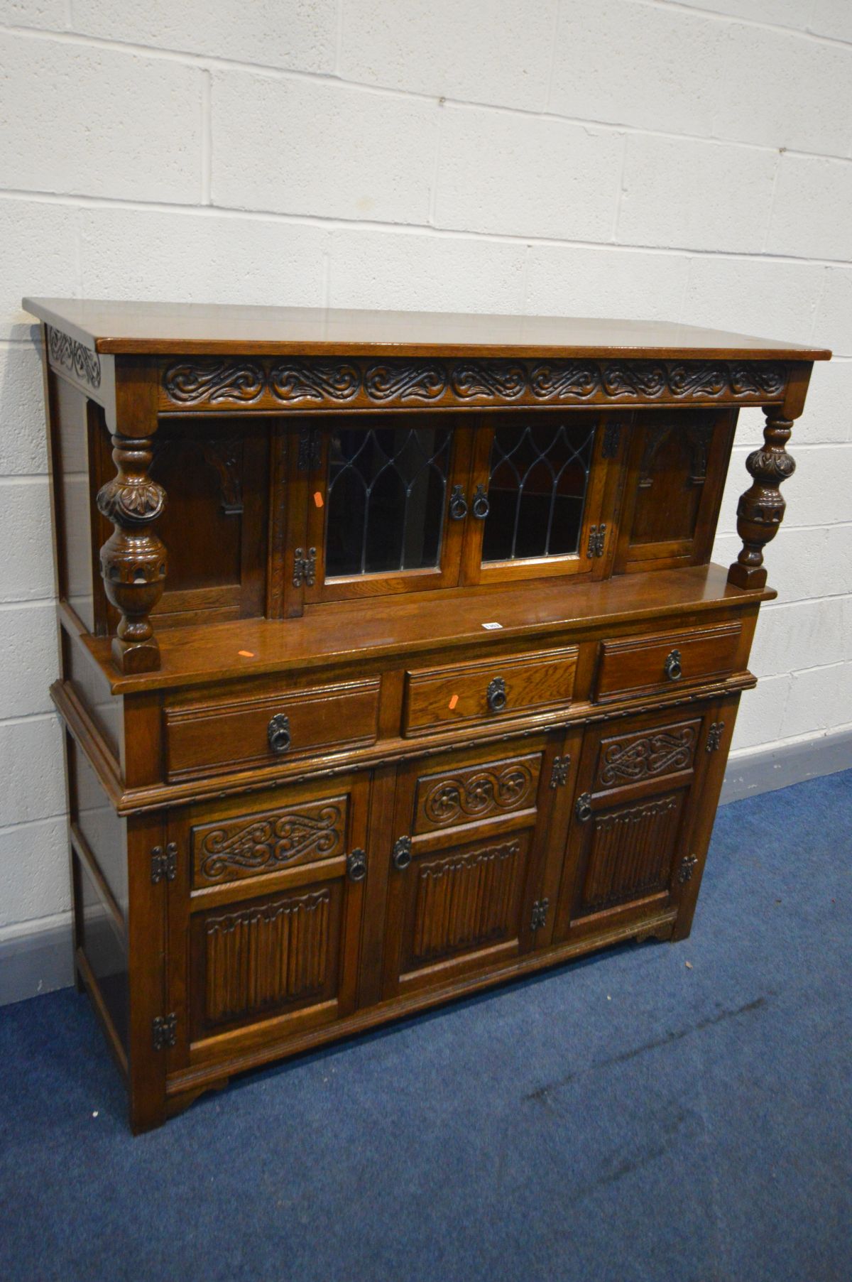 AN OLD CHARM OAK COURT CUPBOARD, with double lead glazed doors above three drawers and three - Image 2 of 2