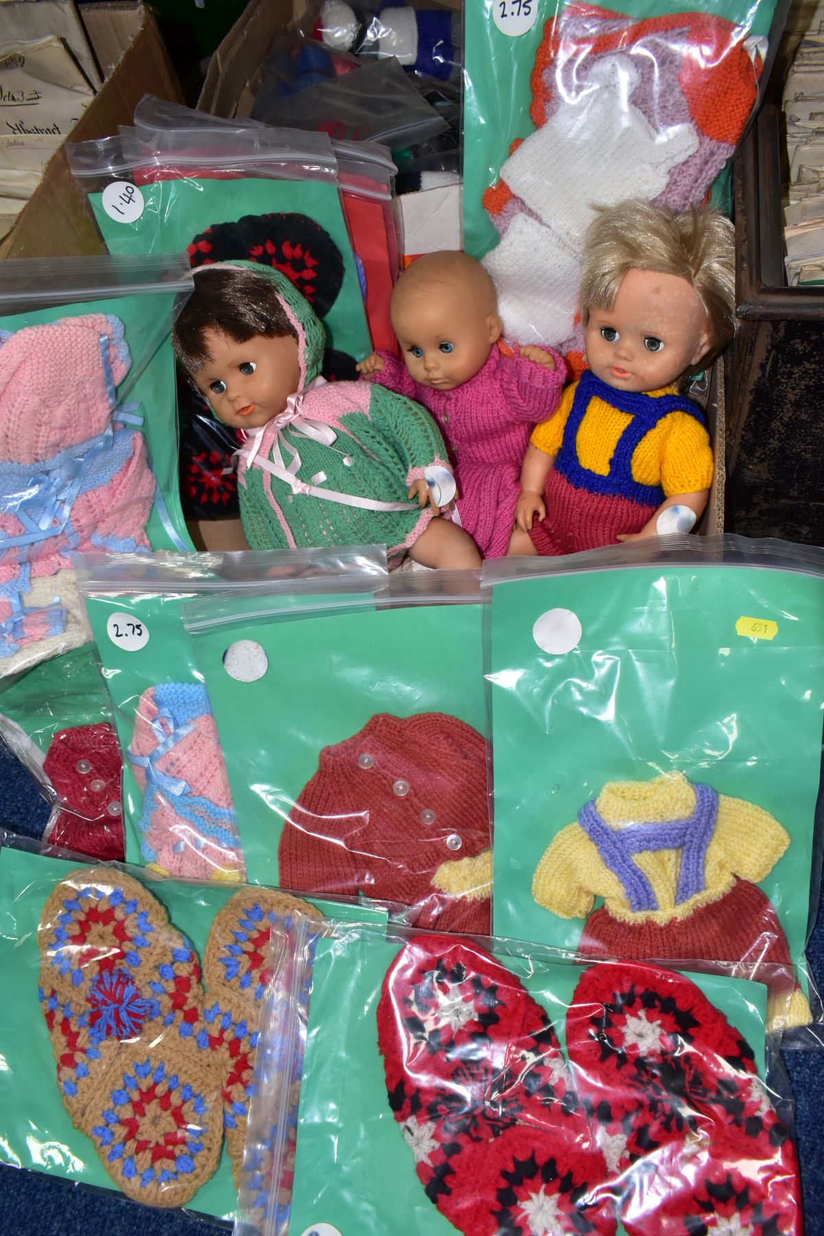 TWO BOXES OF DOLLS, KNITTED TOYS AND KNITTED DOLLS CLOTHES (two boxes)