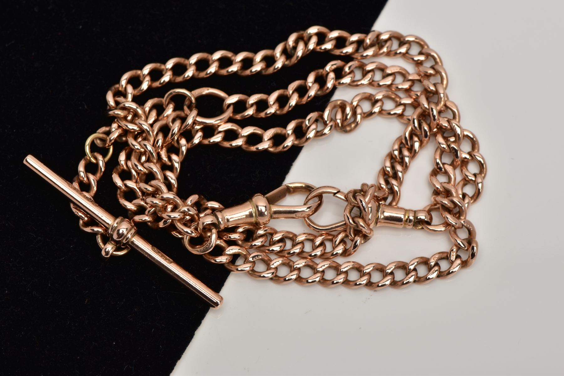 A 9CT GOLD ALBERT CHAIN, curb link chain fitted with two lobster claw clasps, each link stamped 9. - Image 2 of 2