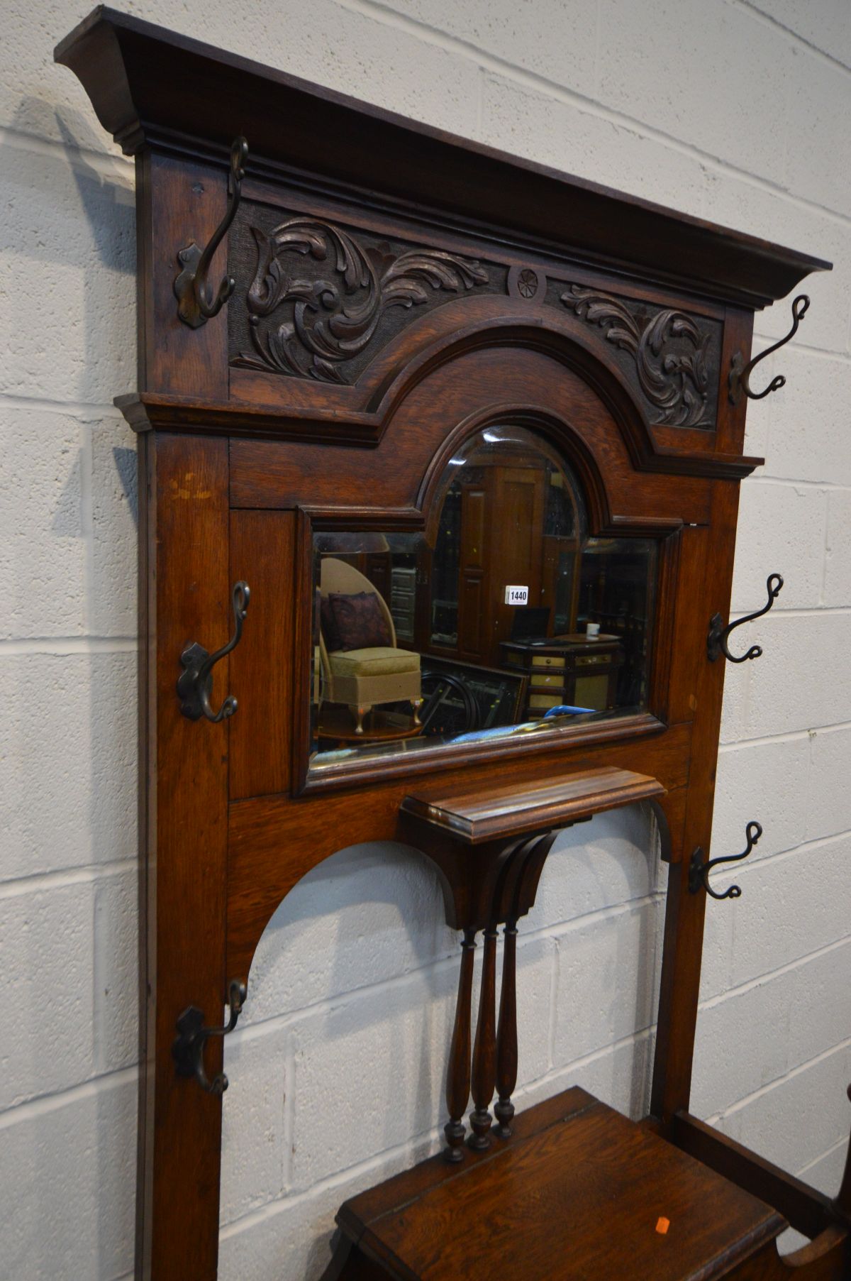 AN EDWARDIAN OAK HALL STAND, with six metal hooks, bevelled edge mirror, hinged storage - Image 2 of 3
