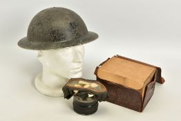 A WWII ERA BRITISH BRODIE STYLE STEEL HELMET, with lining and pads but no chin strap etc, together