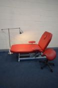 A RED LEATHER ELECTRIC SPORTS MASSAGE TABLE, that's suitable for Therapy, physio and osteopathy,