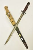 A BRITISH SMLE WWII ERA RIFLE BAYONET with scabbard and three canvas frogs attached, two x sand