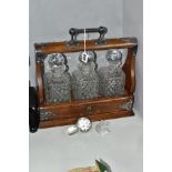 A 20TH CENTURY OAK AND SIVER PLATED TANTALUS, fitted with carrying handle, gothic style mounts,