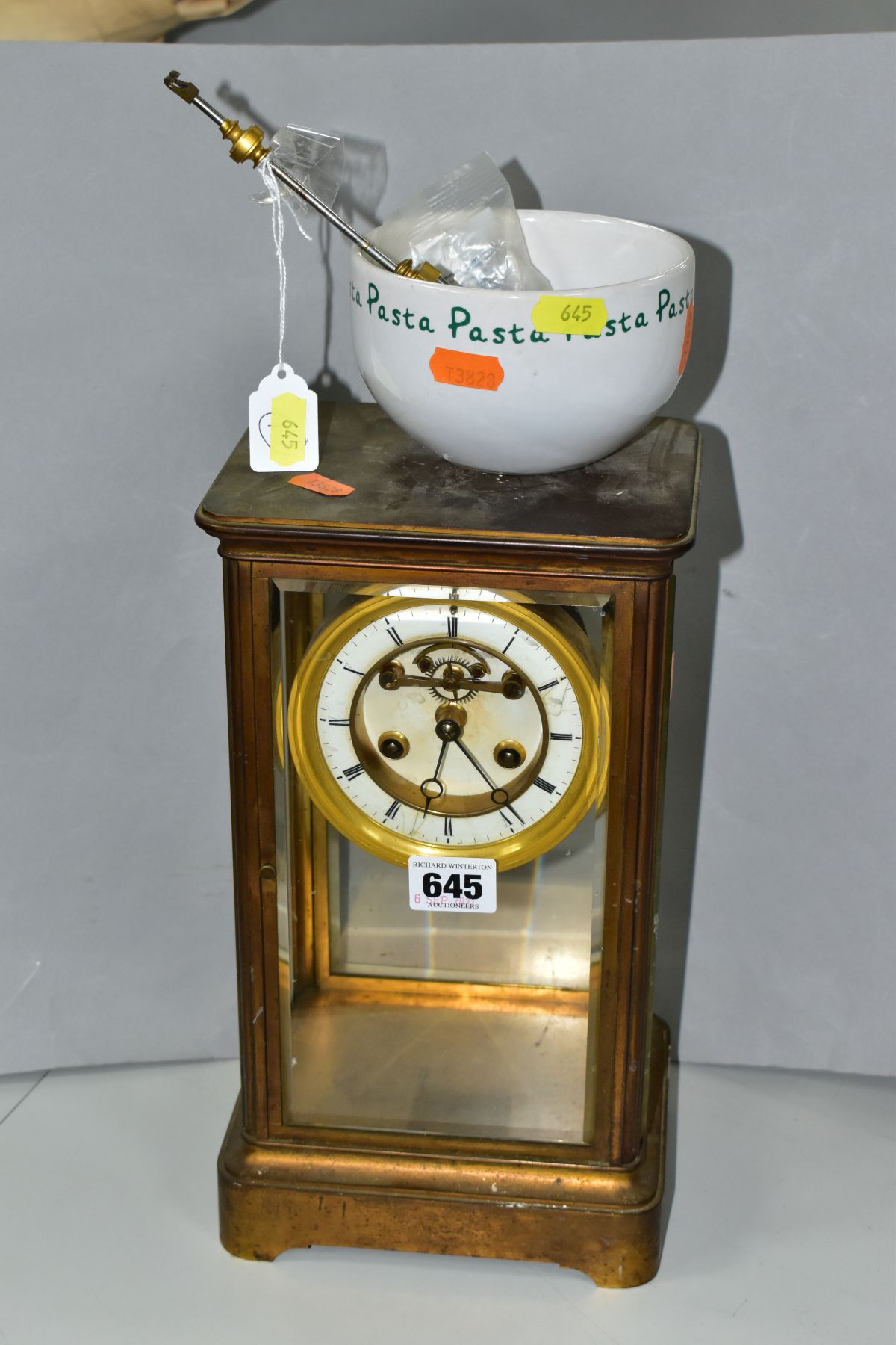 A LATE 19TH CENTURY FRENCH BRASS CASED MANTEL CLOCK OF RECTANGULAR FORM, four glazed panels, white