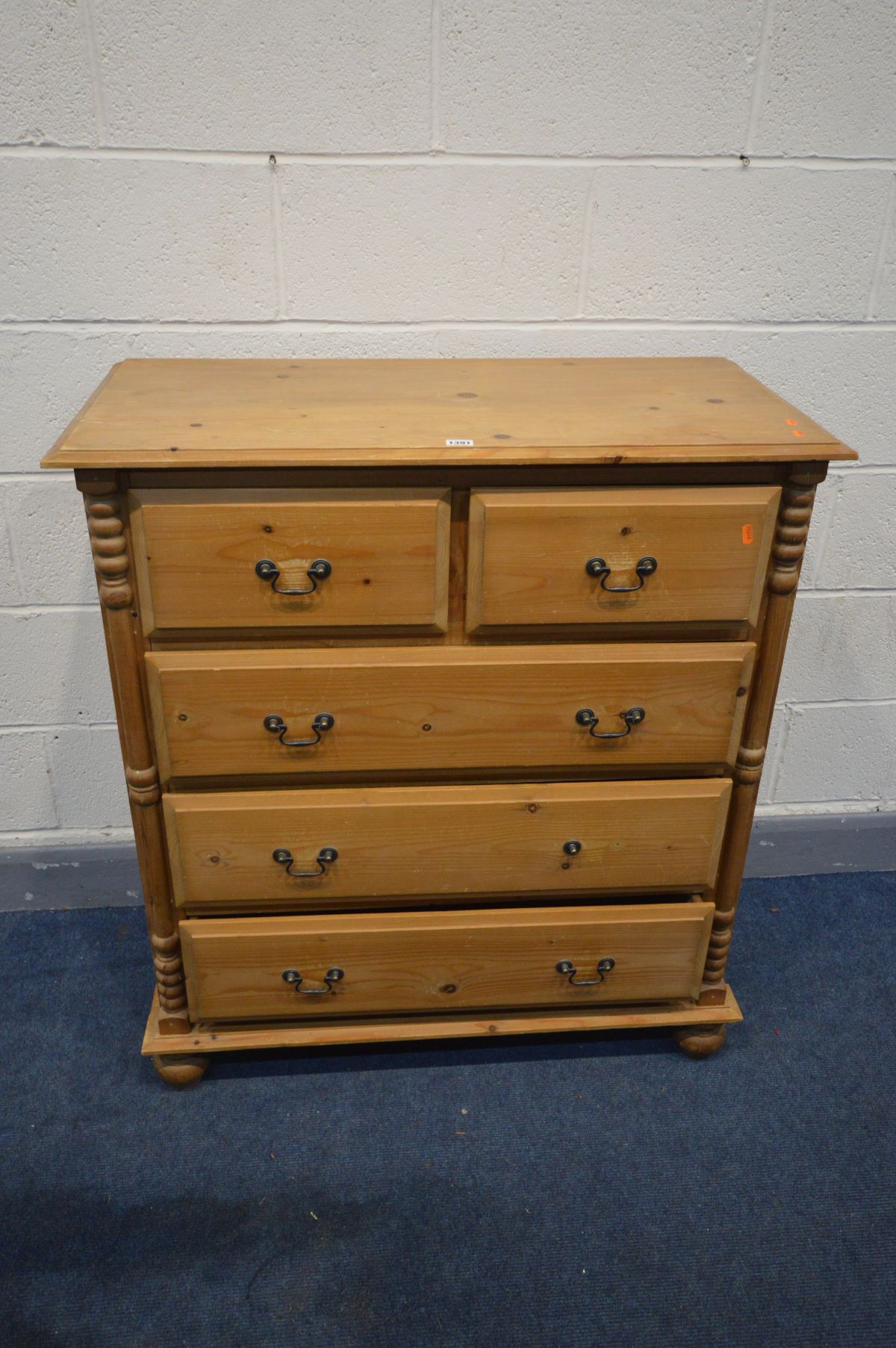 A PINE CHEST OF TWO SHORT OVER THREE LONG DRAWERS, drop handles, on bun feet, width 94cm x depth