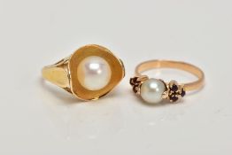 TWO YELLOW METAL CULTURED PEARL RINGS, the first set with a single cultured pearl, flanked with