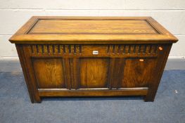 OAK BLANKET CHEST, the top with a fielded panel, lunette frieze above further panels, width 101cm