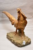 AN EARLY 20TH CENTURY GILT AND PATINATED PLASTER LIFE SIZE MODEL OF AN EXOTIC PHEASANT, with