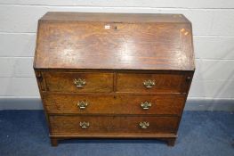 A GEORGIAN OAK BUREAU, with a fitted interior, above four drawers, on bracket feet, width 107cm x