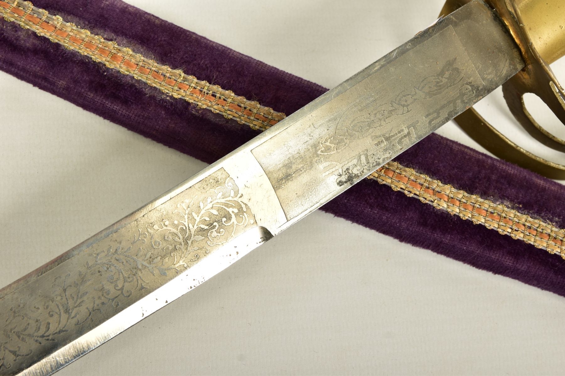 AN INDIAN MADE CURVED SWORD, in a wooden scabbard trimmed with purple coloured velvet style cloth - Image 4 of 12