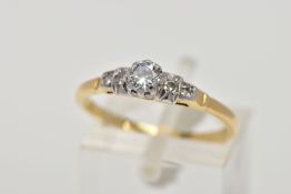 A FIVE STONE DIAMOND RING, designed with a central brilliant cut diamond within an eight claw mount,