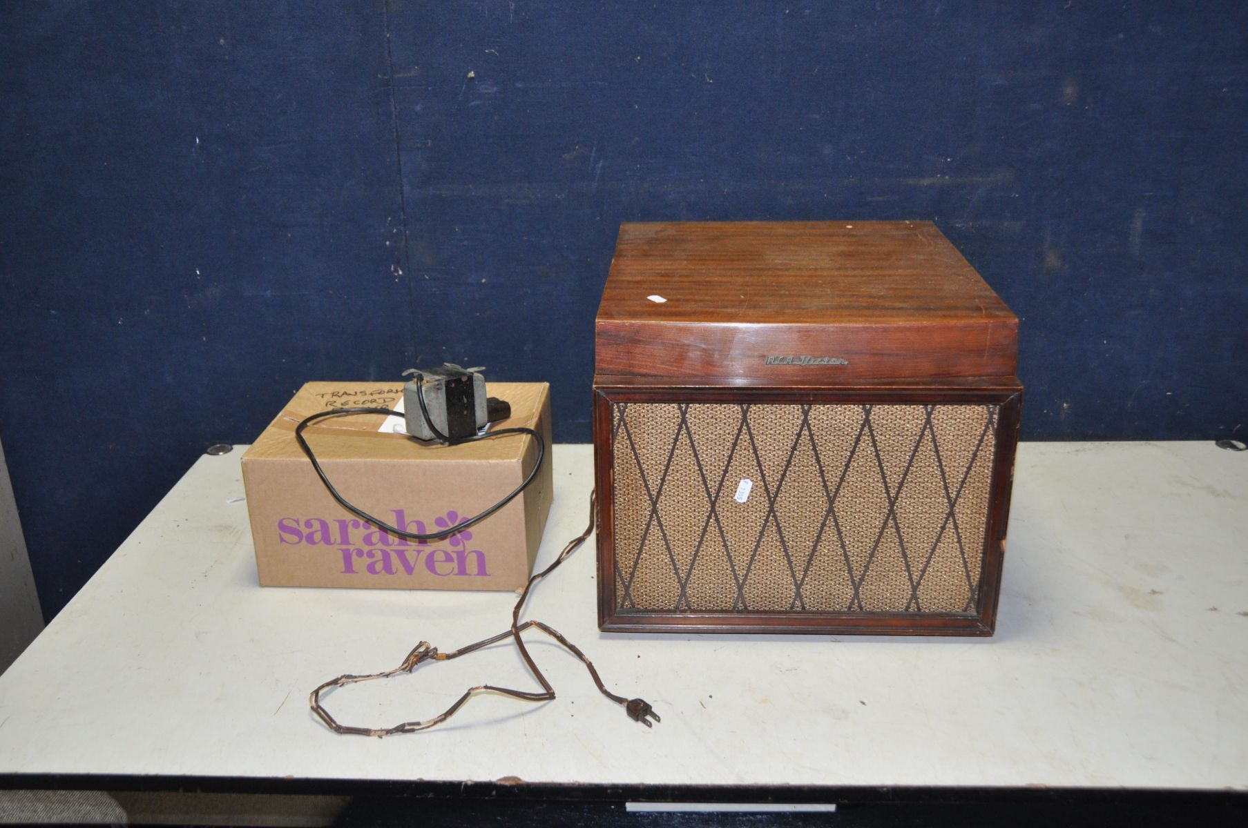 A VINTAGE RCA VICTOR VICTROLA RECORD PLAYER in a Mahogany cabinet with a BSR turntable and spare