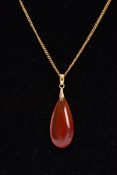 A PENDANT AND CHAIN, the pear shape carnelian pendant suspended from a fine curb link chain, chain