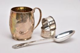 A SILVER CHRSTENING CUP, SILVER TABLESPOON, AND TWO SILVER NAPKIN RINGS, plain polished gilt, bell-