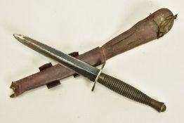 AN EXAMPLE OF A MKIII VARIANT OF THE FAIRBURN SYKES FIGHTING KNIFE, together with leather