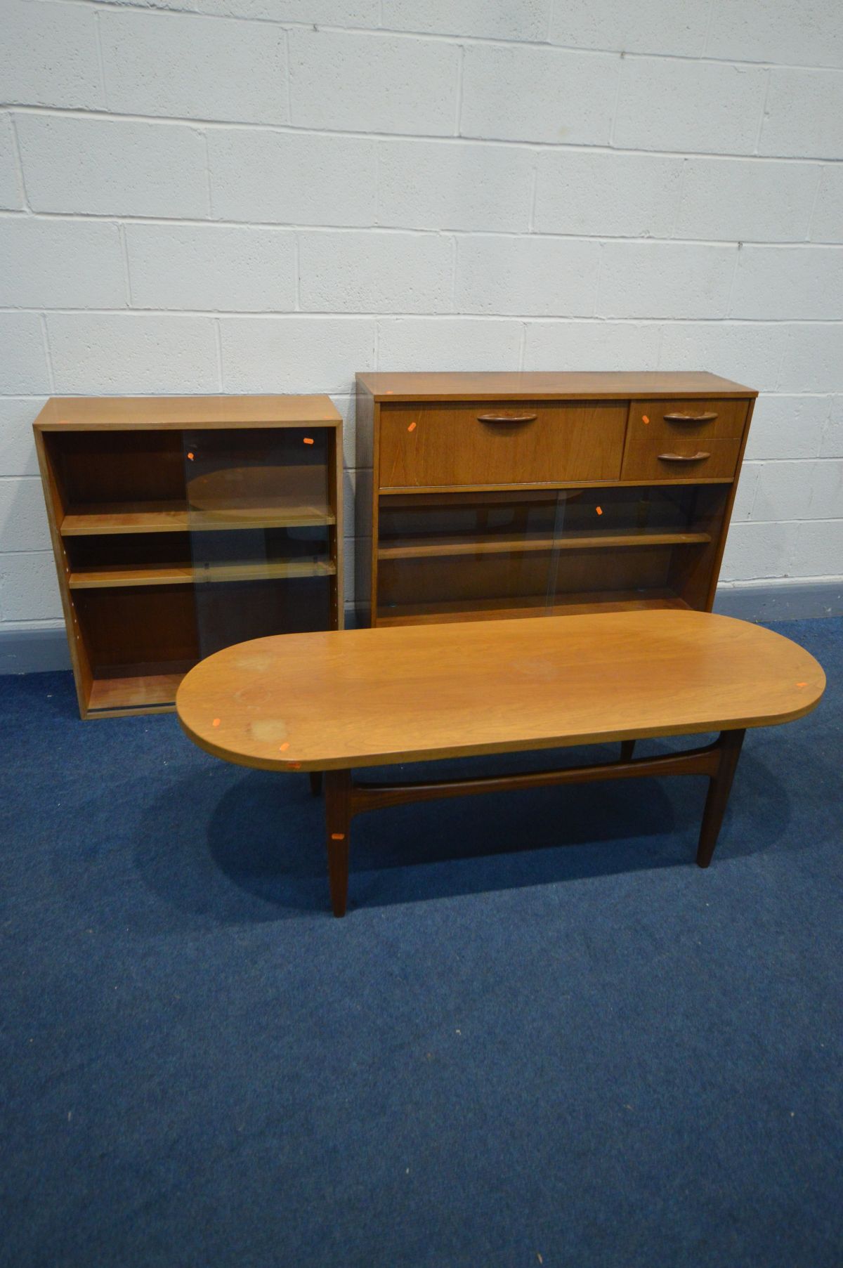 A MID 20TH CENTURY DANISH STYLE TEAK BOOKCASE, with a fall front compartment besides two drawers,