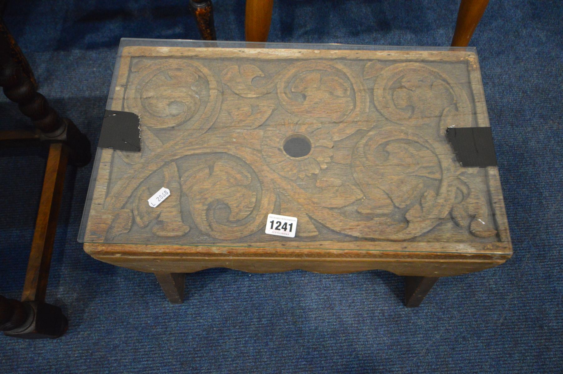 A CARVED OAK STOOL, with a later base and glass panel, along with an oak tea trolley, two chairs and - Image 3 of 3